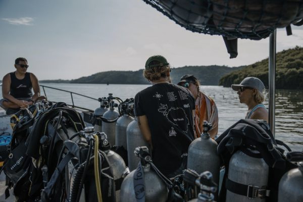 Guide briefs divers on the boat